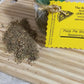 Pizza pie seasoning packet on a wooden cutting board with visible text