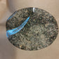 Close-up of a circular window of kraft bag of potato salad seasoning 