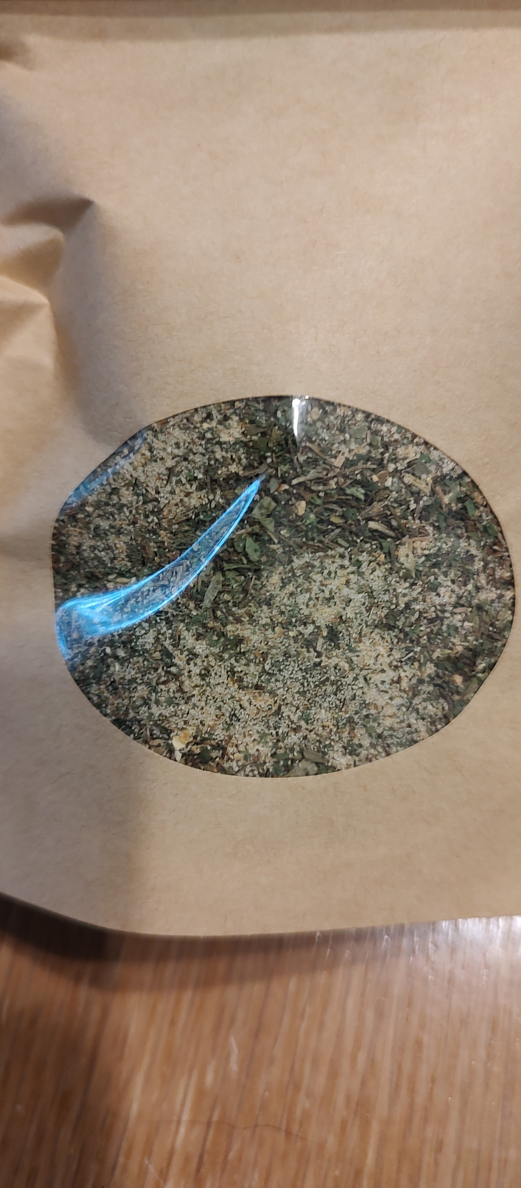 Close-up of a circular window of kraft bag of potato salad seasoning 