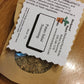 eco kraft bag of Herbal seasoning labeled 'Potato Salad Seasoning' on a wooden surface