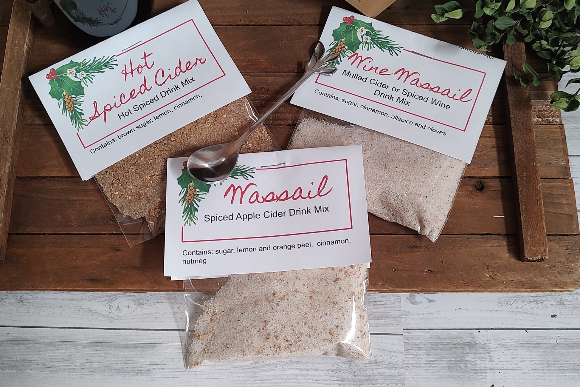 Three packages of Wassail, wine, and hot cider blends

