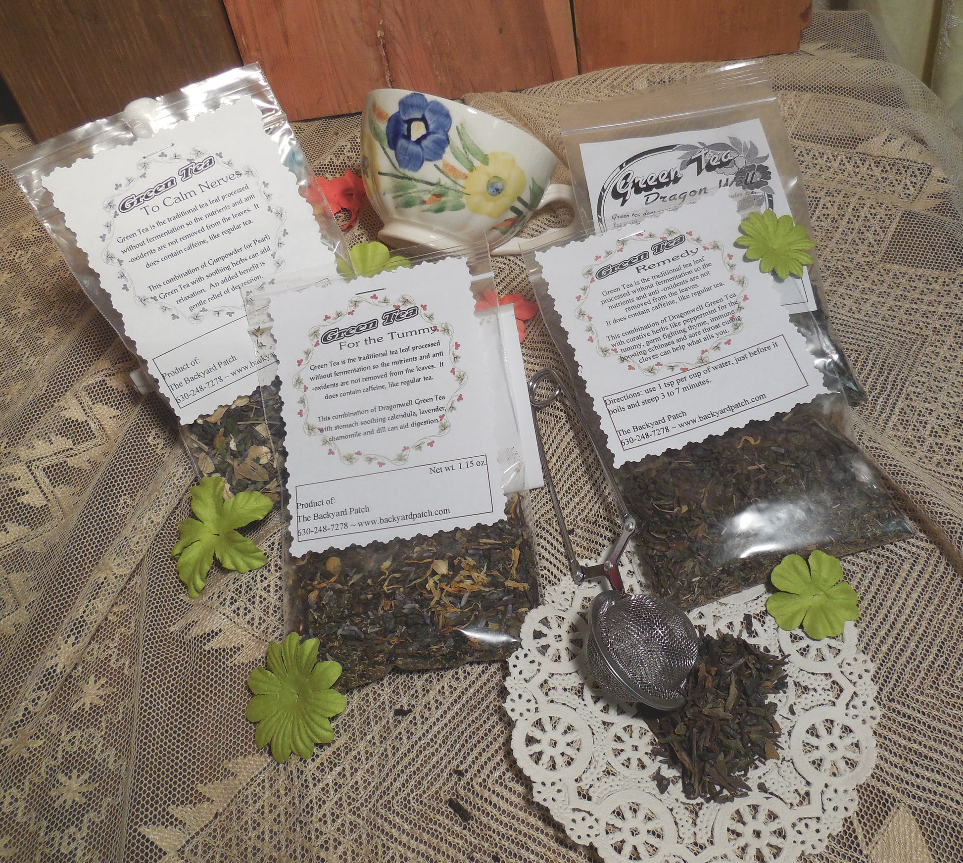 Tea packaging with loose tea leaves on a lace tablecloth