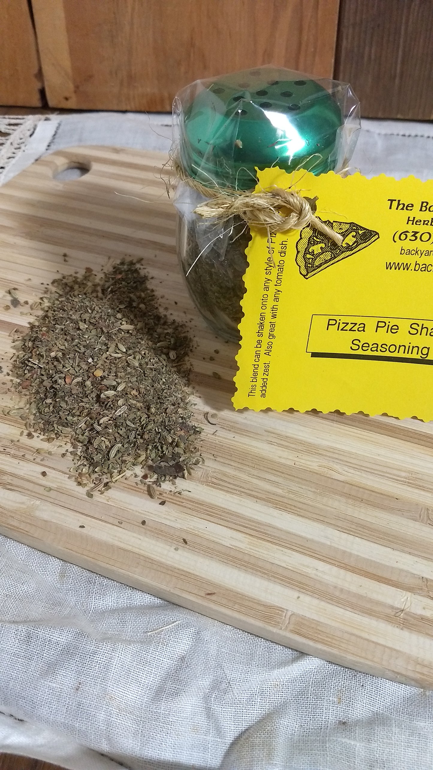 Pizza pie seasoning packet on a wooden cutting board with visible text