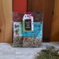 Packaged potato salad bundle of 4 herb mixes with a tag on a wooden surface