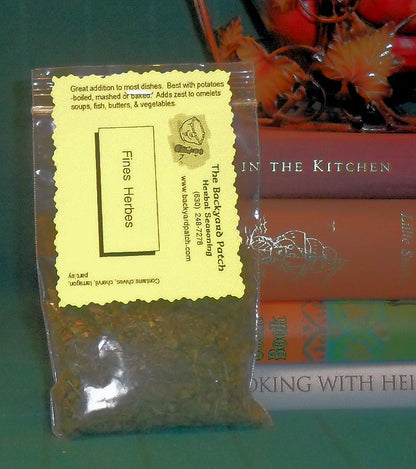 Fine herbs in zip seal bag with cookbooks in the background
